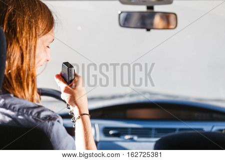 Young Man Driving Car Using Cb Radio
