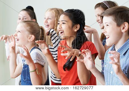 Group Of Children Enjoying Drama Club Together