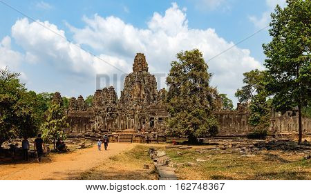 Siem Reap, Cambodia - February 2, 2016: Unidentified tourists visit to Prasat Bayon in Angkor Thom Complex, Siem Reap, Cambodia. Ancient Khmer architecture famous Cambodian landmark World Heritage