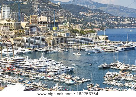 Monte Carlo city skyline panorama. Close-up view of luxury yachts and apartments in harbor of Monte Carlo Monaco Cote d'Azur