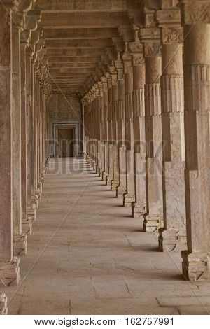 MANDU, MADHYA PRADESH, INDIA - NOVEMBER 18, 2008: Cloisters in the ancient tomb of Hoshang Shah in Mandu, Madya Pradesh, India. 15th Century AD