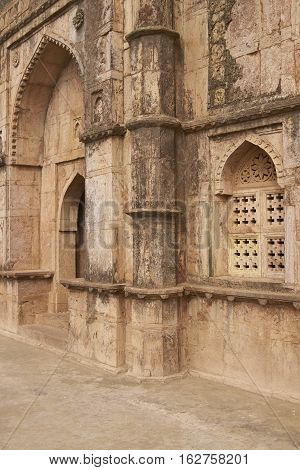 MANDU, MADHYA PRADESH, INDIA - NOVEMBER 18, 2008: Detail of carved stonework of Darya Khan's tomb in the hilltop fortress of Mandu. 16th Century AD