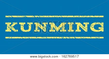 Kunming watermark stamp. Text tag between horizontal parallel lines with grunge design style. Rubber seal stamp with dirty texture. Vector yellow color ink imprint on a blue background.