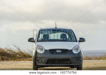 White Old Kia Picanto City Car On Desert