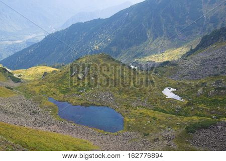 Beautiful Mountain Lake Surrounded By Impressive Mountains Of The Khamar-daban.
