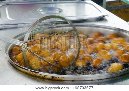 Istanbul Turkey - Eminonu traditional ottoman bite sweet sellers made in boiling oil. There is no denying that desserts are a massive part of Turkish culture. When walking around Istanbul you can see a sweet seller just on almost every corner with mouthwa