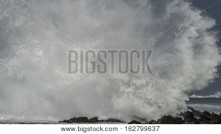 Massive Wave Brkes On Rocks