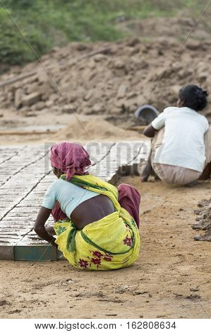 Illustrative image. Pondicherry Tamil Nadu India - July 03 2014. Poor woman worker in small village very hard work for little money roupies