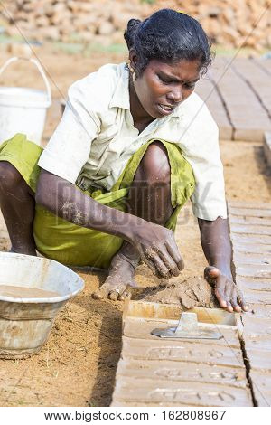 Illustrative image. Pondicherry Tamil Nadu India - July 03 2014. Poor woman worker in small village very hard work for little money roupies