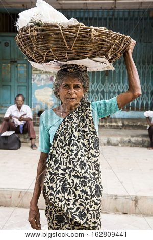 Illustrative image. Pondicherry Tamil Nadu India - July 03 2014. Poor woman worker in small village very hard work for little money roupies