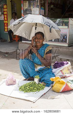 Illustrative image. Pondicherry Tamil Nadu India - July 03 2014. Poor woman worker in small village very hard work for little money roupies