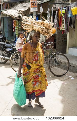 Illustrative image. Pondicherry Tamil Nadu India - July 03 2014. Poor woman worker in small village very hard work for little money roupies