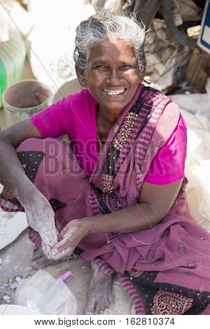 Illustrative image. Pondicherry Tamil Nadu India - July 03 2014. Poor woman worker in small village very hard work for little money roupies