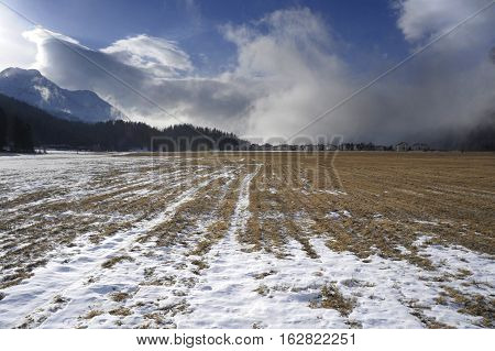 amazing landscape scenic view of Engadin valley in Switzerland Sils Maria village with snow on Alp mountains and frozen ground on a cold sunny winter day in tourism and holiday destination