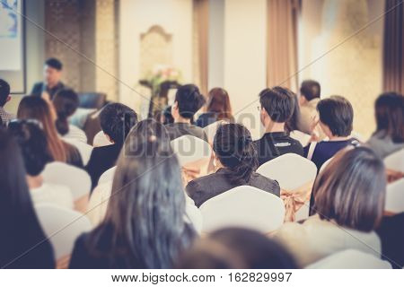 asia people listen speaker man in business seminar hall of hotel room vintage filter selective focus.