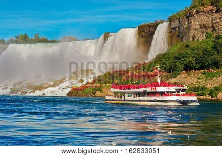 Boat Hornblower With Tourists Against American Waterfall.