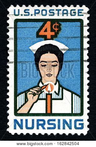 UNITED STATES OF AMERICA - CIRCA 1961: A used postage stamp from the United States of America dedicated to the profession of Nursing circa 1961.