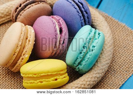 Set of sweets from cookies macaron on table cloths made of textile