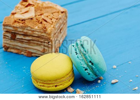 French macaron cookies on a blue wooden table