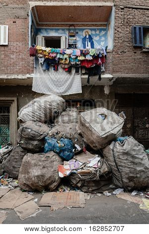 Street scene in Manshiyat Naser or Garbage City in Cairo with balkony