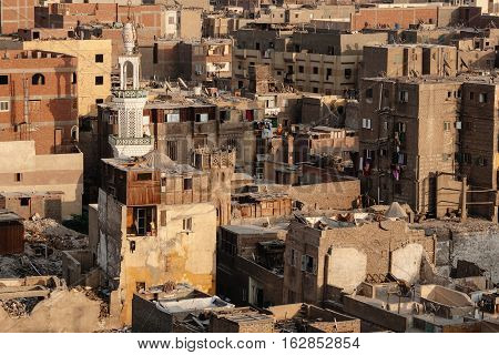 Overpopulated dusty Old Cairo street view from above with old mosques and minarets in Cairo Egypt