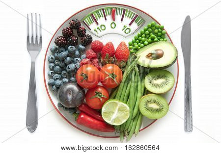 Bathroom weighing scales made of vegetables including chives betroot and pepper