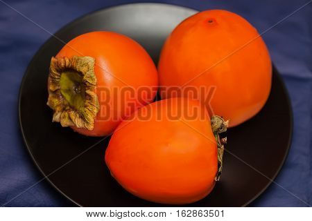 Persimmon fruit is a golden yellow flavorful delicacy from far East Asian origin.