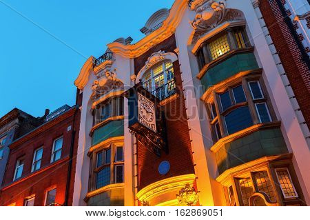 Perruquier Costumiers Building With Antique Clock In Chinatown, London