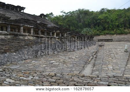 Ruins and drainage canals during a thunderstorm at the pre-Columbian archeological site El Tajin in Papantla, Veracruz, Mexico