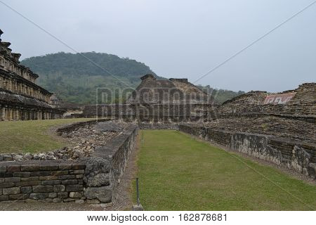 Ruins and pyramids during a thunderstorm at the pre-Columbian archeological site El Tajin in Papantla, Veracruz, Mexico