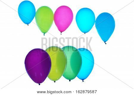Colorful balloons arranged in two rows on light background