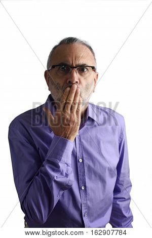 Man with hand in mouth with a white background