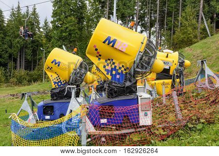 Snow gun. Snow making machine. Machine that makes artificial snow and blows it onto ski slopes.