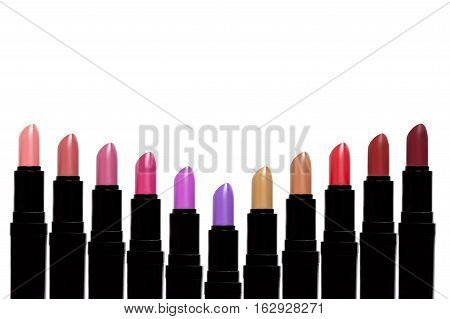 Set Of Color Lipsticks Forming V Shape. Lipstick Set Isolated On White Background