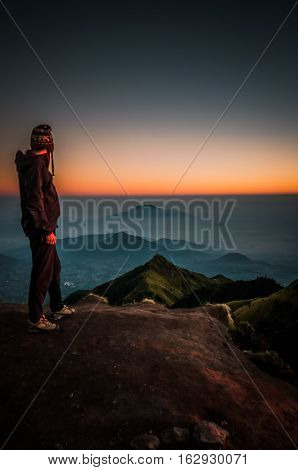 Hiker Looking At Mountains