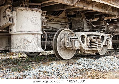 Old dirty wagons wheel of industrial train