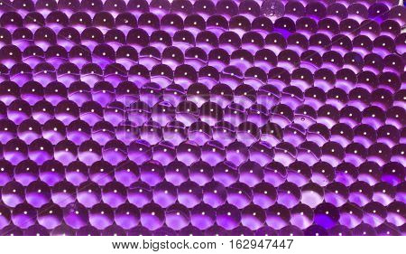 beautiful bright background of purple hydrogel beads, texture