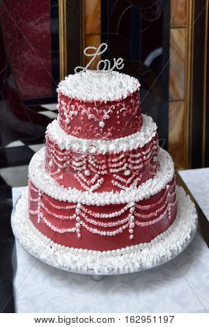wedding red white cake on a table