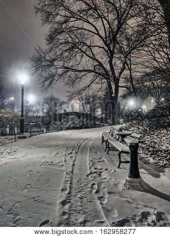 Gapstow Bridge is one of the icons of Central Park Manhattan in New York City during snow storm at night