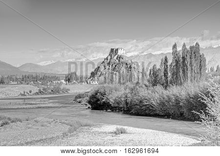 Stakna monastery with view of Himalayan mountians - it is a famous Buddhist temple inLeh Ladakh Jammu and Kashmir India. Black and white image.