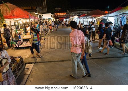 BANGKOK THAILAND - SEPTEMBER 17 2016: tourists walk to shop at Night market Srinakarin road or train market. This market is open every Wednesday to Sunday.