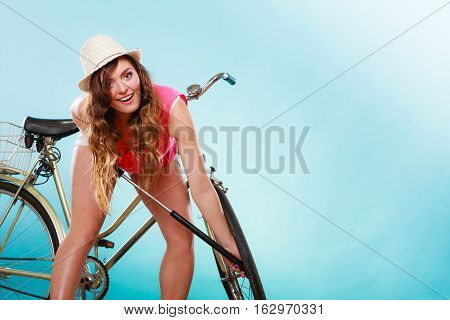 Woman Pumping Up Tire Tyre With Bike Pump.