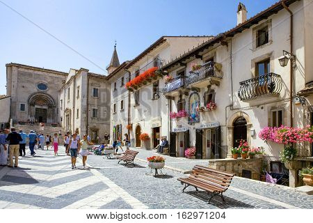 Pescocostanzo Italy - August 19 2006: Local people between the traditional architecture of the country center