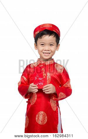 Little Vietnamese boy holding red envelops for Tet. The word mean double happiness. It is the gift in lunar new year or Tet Holiday on red isolate background.