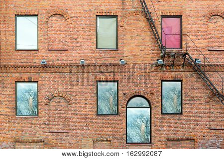 Architectural diversity in centre of resort Estonian town Parnu. Historic brick buildings and attractions. Brick texture old wall of red blocks