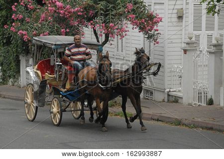 ISTANBUL/TURKEY, AUGUST 13, 2016: Phaeton and driver at the Buyukada Island's streets