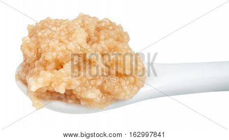 Salty Caviar Of Herring In Ceramic Spoon Isolated
