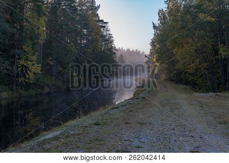 Calm And Foggy Morning Near A Channel In Sweden