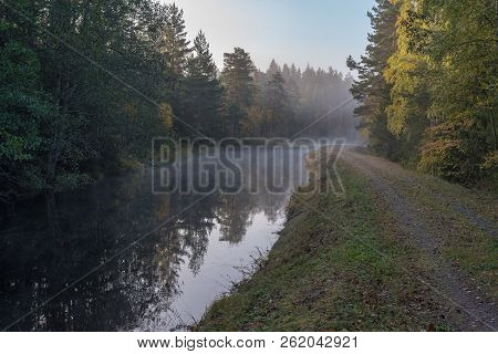 Calm And Foggy Morning Near A Channel In Sweden
