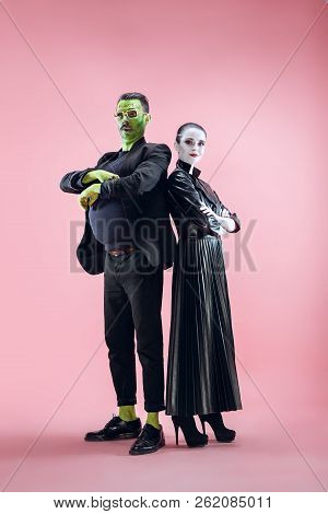 Halloween Family. Happy Couple In Halloween Costume And Makeup. Bloody Theme: The Crazy Maniak Faces